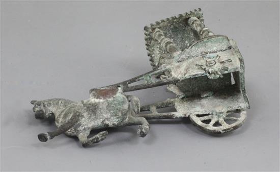 A Chinese archaic bronze model of a horse and carriage, Han dynasty, 2nd century B.C.-2nd century A.D., 12.5cm long, losses